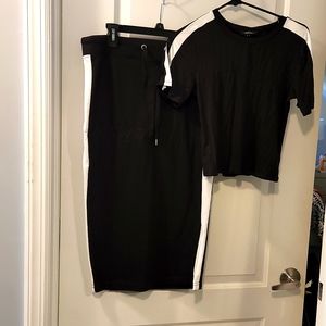 Brand new 2 piece black and white skirt set with slit in the side of the skirt